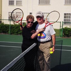 Grandma and Granddad playing tennis in Florida