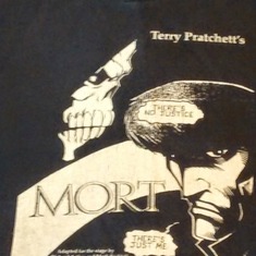Way back in the '90s, Richard adapted a couple of Terry Pratchett books for the stage, with a very small amount of help from me, mostly as sounding board and bad idea rejecter. This photo shows the poster design, on a dark blue sweatshirt, for "Mort". The