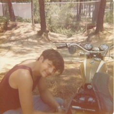 Daddy working on his bike in the 1977