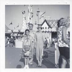 Not sure where this is buy it's my mom and her parents (looks like Disneyland)