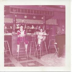 the famous bar at my grandparents place.  Di and my mom when they were young