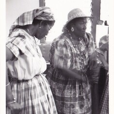 Rita pounding plantains at Settlement Day Celebration