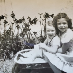 Older sister Rannie (5) with Phyllis (2) in 1951