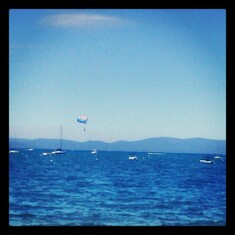 Your up in the air flying in the wind parasailing in Tahoe with Forrest and Anthony