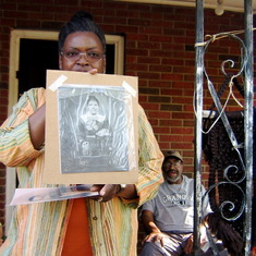 Ernestine holds up Great Great Granmothers pic& Daddy in TN