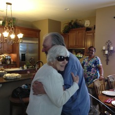 Dad's mother came to visit in October 2014. We celebrated Thanksgiving and Christmas that weekend. Blossom, dad's full-time caregiver full of Joy stands in the background as they embrace.