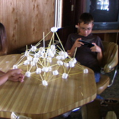 Pop helped Clayton and Jaclyn build a marshmallow structure, a camp fire and how to whittle. January 2007.