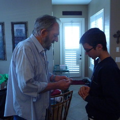 Christmas 2009, Pop trying to teach Clayton something to do with a bow and arrow that he and Jaclyn were making. Clayton loved learning from Pop.