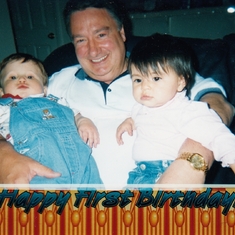 Holding his grandson, Sam and Troy Feinberg