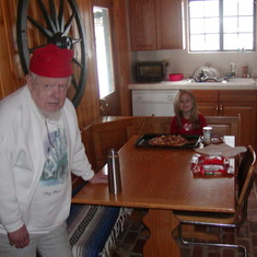 Pappy supervising Patie building a world class pizza...Check out the sweatshirt Pappy has on....I got it off the dollor rack becuase the picture of the wolf is upside down....He thought it was funny it was his main sweatshirt....and also liked to point ou
