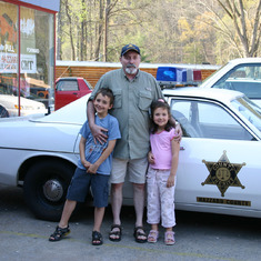 Dad and Kids with Sheriff car