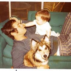Bob and Eric with Rexy on couch. Dig those stripped bell bottom pants and side burns.