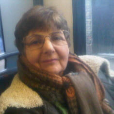 On bus in London - Debi bundled her up