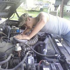 Joshua working on the truck Rod bought for him