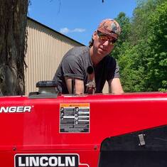Rodney with his new welding machine. Fall of 2019