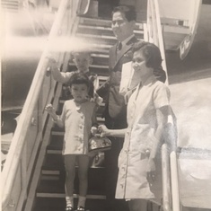 Dad boarding the plane on his way to America