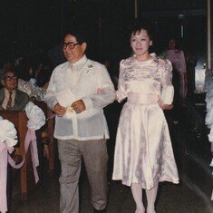 Ninong Romy Abesamis walks down the aisle with ninang Eileen; wedding day, June 1986.