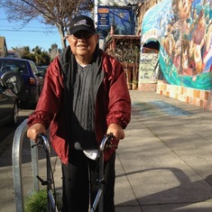 Dad taking a walk down Shattuck Ave in Berkeley passing La Peña Cultural Center