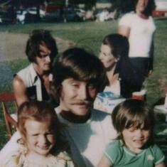 That's my dad & my mom in background & me & my cousin Sherrie w my uncle John another peson we lost too soon & miss very much