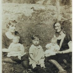 Granny Cox holding Rosie, Bill Jr., Lou (Marcum's wife) holding Marcum Jr.