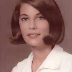This hardly looks like her it's so polished and perfect, both folks from Chattanooga will remember that hair flip! This is her senior high picture.