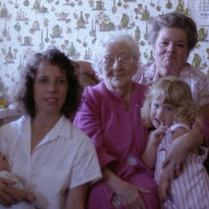 Mom with Grandma Prado, Charmaine, Emily, and Stuart