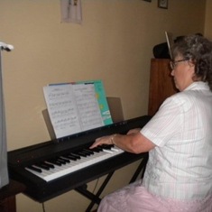 Mom enjoying the girls' keyboard on her first visit back to Malawi after we moved there