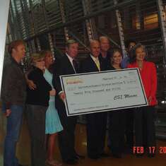 Rose with the cast of CSI:Miami as they present a check for the California Forensic Science Center