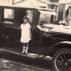 1927 circa.  Rosemary with family car.