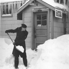 dad shovelling snow. If anyone knows where this is, you can add a story to this image.