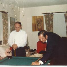 Celebrating Christmas several years ago..My brothers Jr. & Roy always had to see who the best pool player was.