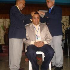 Ruben ordaining Humberto Rosario to the office of seventy