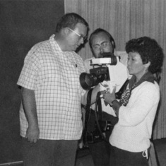 Ruby Iwamasa with TV camera, along with Cliff Saladine and Guy Serumgard.