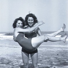 Ruth holding Kay Martin at the shore