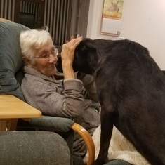 Ruth gives her grandpuppy "Peachie" a kiss
