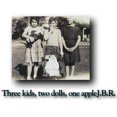 Three kids, two dolls, one apple
