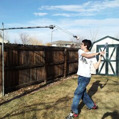 Ryan practicing hitting in our backyard