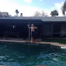 Showing Uncle Eric & Aunt Dana how he jumps off the roof into the pool in AZ