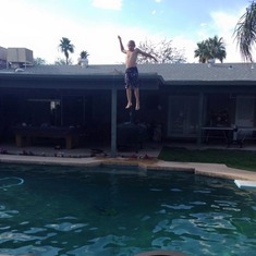 Showing Uncle Eric & Aunt Dana how he jumps off the roof into the pool in AZ