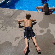 Ryano sunbathing at Kelly & Daryl's pool