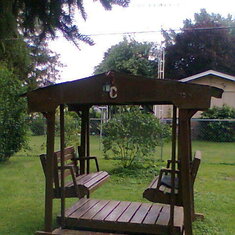 MOM'S SWING IN THE BACK YARD, DAD GAVE HER AS A GIFT FOR THEIR ANNIVERSARY