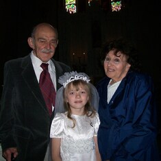 Grama and Pappy with Regina on her 1st Holy Communion