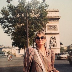 Mama in front of the “Arc de Triomphe” in Paris.