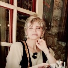 Mama at a Bistro in Montmartre (Paris) when she was much younger.