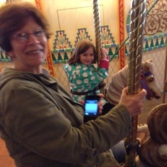 Carousel ride at Disneyland Tokyo with her granddaughter.  