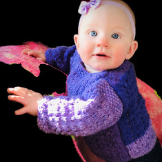 Sandy's knitted purple baby sweater 