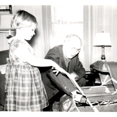 Sarah playing with her grandfather Ellis Williams about 1951