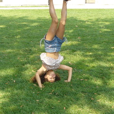 Sarita doing headstands at Ellis Island