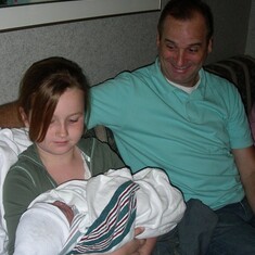Uncle Scott, Katie and Kya on the day she was born.