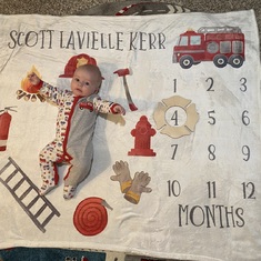 Baby Scott is 4 months old today :) still going strong with the fire fighter swag in honor of Opa!